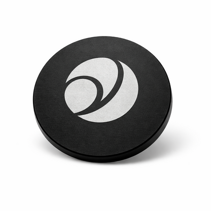 Black circular object with a white logo on a white background
